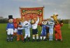 Manchester football mascots holding banner from Procession, 2009